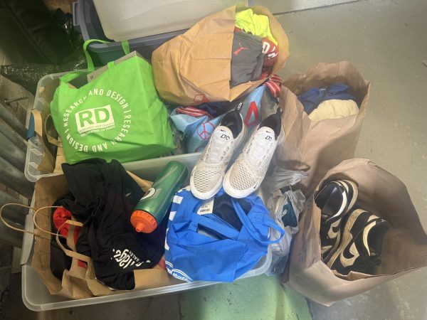 Some of the donations of athletic wear collected by the girls' varsity swim & dive and soccer teams. 