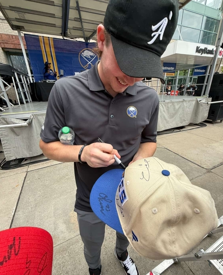 Zach Benson took time to connect with fans at the Sabres FanFest, signing hats and memorabilia with a smile. Excitement filled the arena as attendees got up close with one of Buffalo’s most promising young talents. Benson continues to make a name for himself, showing both skill on the ice and appreciation for the Sabres’ loyal fanbase.