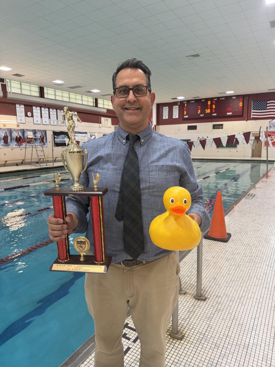 Coach Norv Humphrey and the ECIC Division 1 Team Champion Trophy
